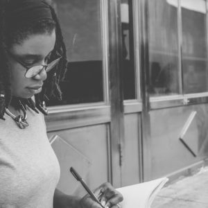 Woman writing in journal